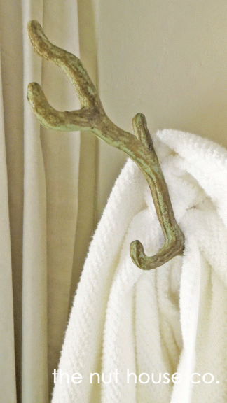brass and green towel branch hanger